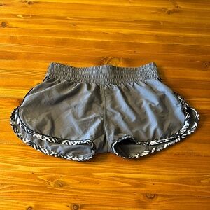 Under Armour women’s running shorts with liner. Size small, ties at waist.